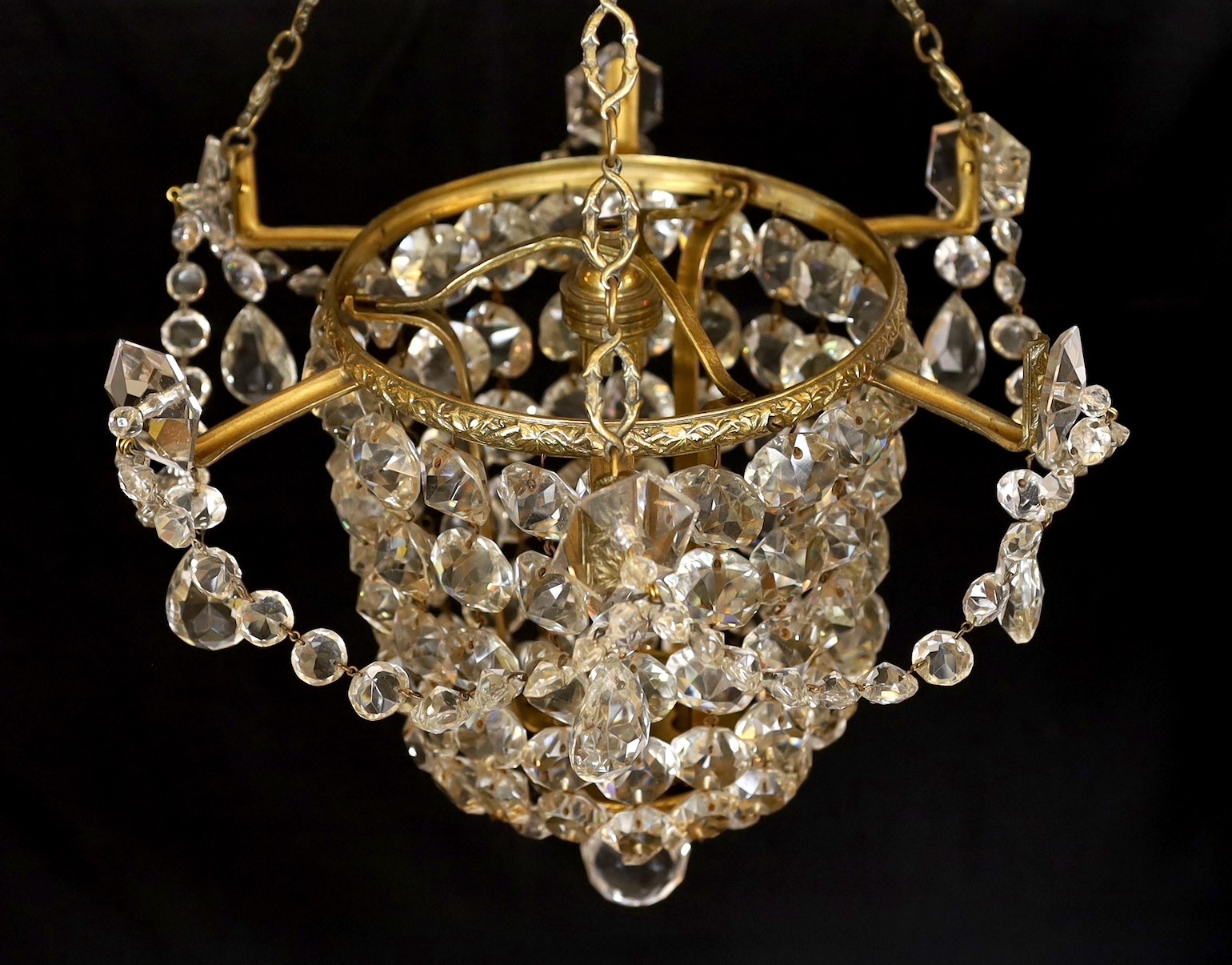 A 1930s lead crystal and brass bag shaped light fitting, height 53cm. width 36cm